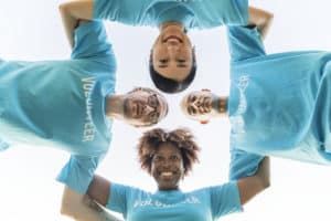 Group of happy and diverse volunteers Hard Rock International