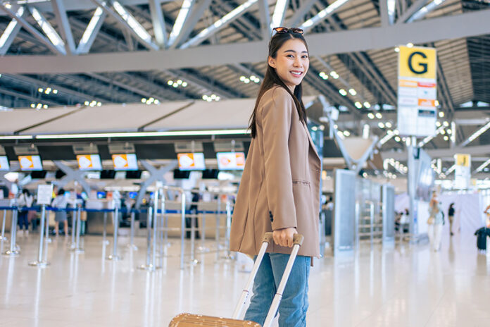 portrait-of-asian-young-girl-walk-in-airport-termi-2023-11-27-04-52-00-utc safest